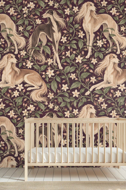 Saluki Jasmine wallpaper behind a black iron bed with white bedding and bedside table with flowers.
