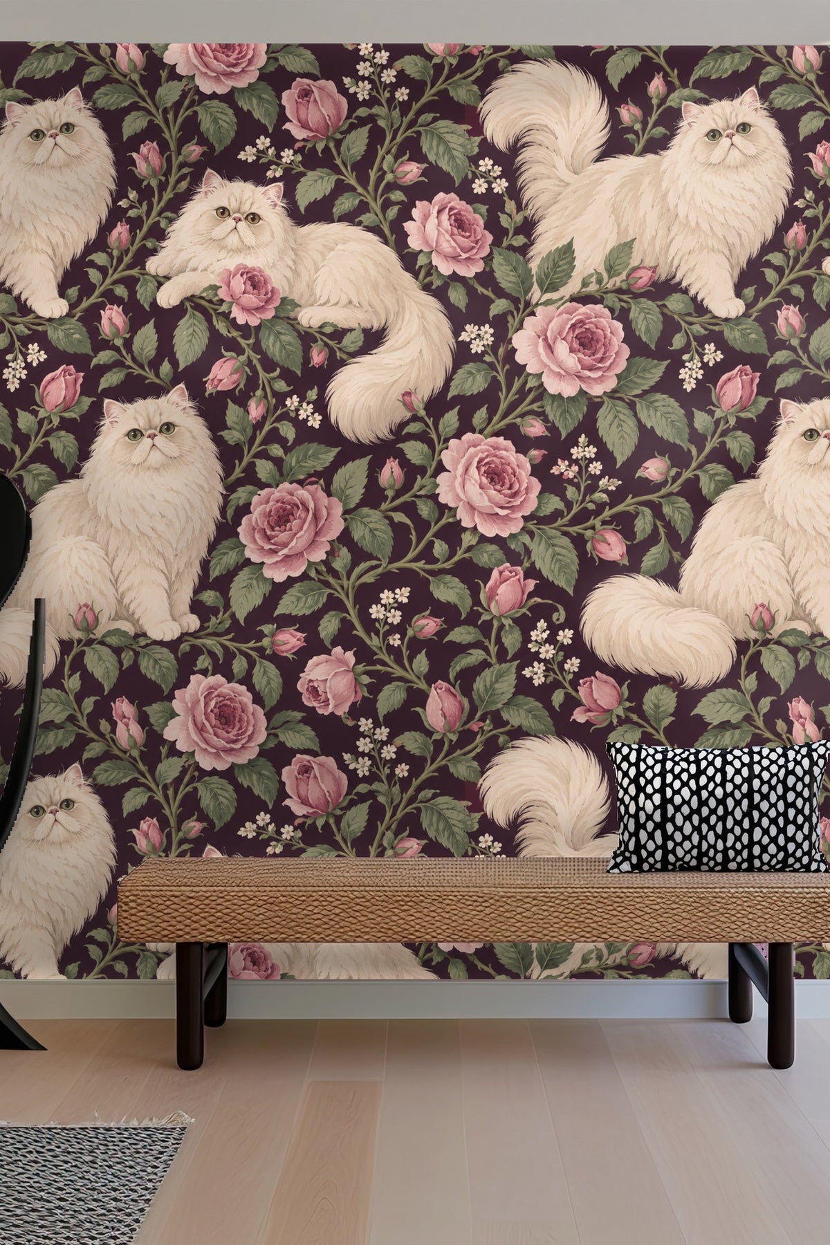 Three cream Persian cats positioned around pink roses on wallpaper panel