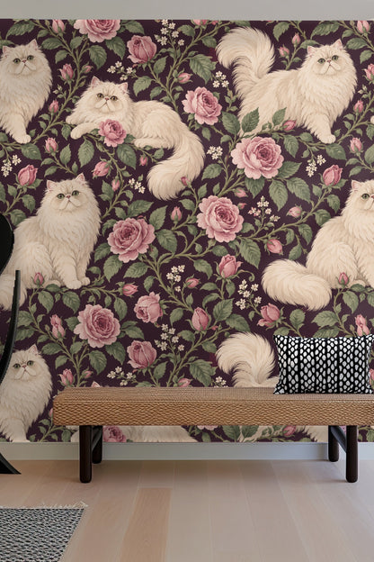 Three cream Persian cats positioned around pink roses on wallpaper panel
