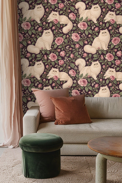 Bedroom wall with Persian Rose Cats wallpaper behind woven cane headboard and white bedding