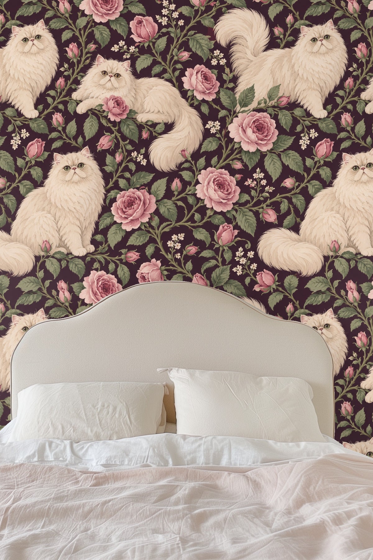 Arrangement of pink rose buds and flowers intertwined with Persian cats on deep plum wallpaper