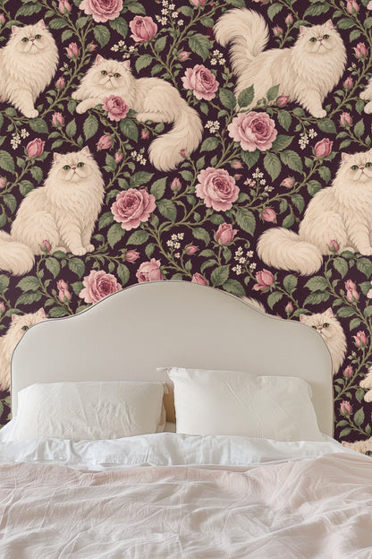 Arrangement of pink rose buds and flowers intertwined with Persian cats on deep plum wallpaper