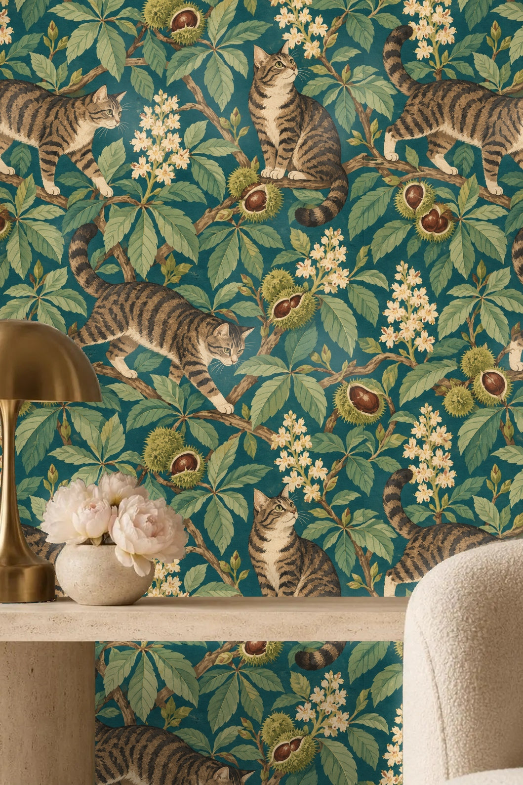 Three tabby cats at varying poses among sprawling chestnut branches and botanical foliage on wallpaper