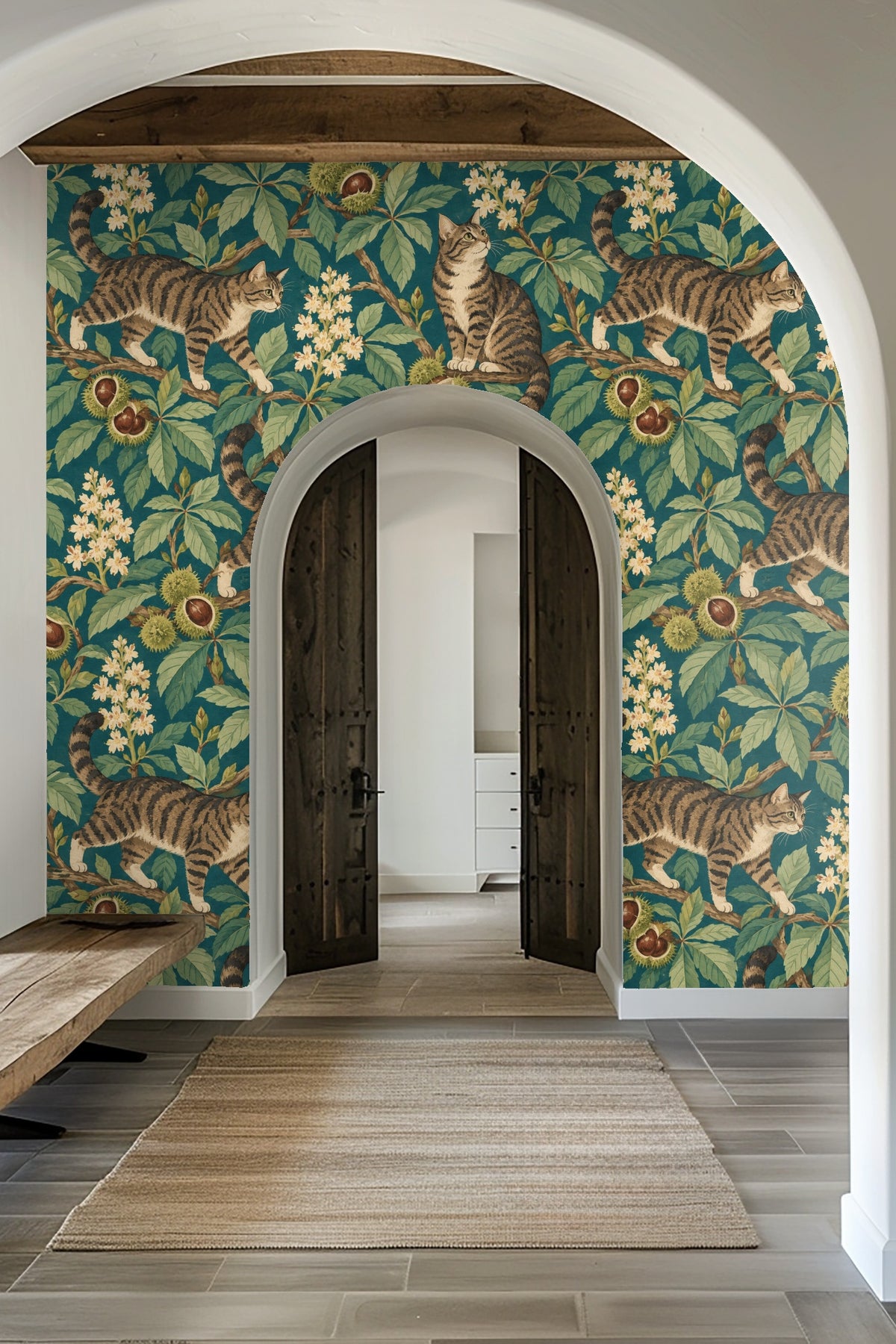Laundry room with Chestnut Park Cats wallpaper showing tabby cats on chestnut branches, blending with wood shelves and white towels
