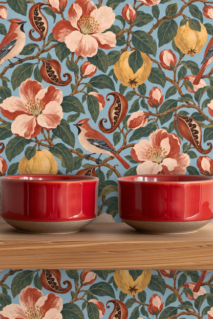 Cluster of quinces in various ripeness stages among leafy branches and pink flower buds on wallpaper