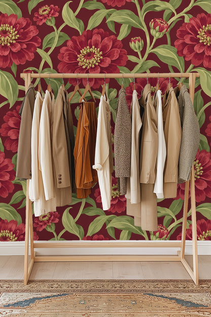 Angle view of red zinnia wallpaper and partial orange armchair in a bright living room