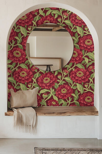 Living room with an orange sofa and large red zinnia flower wallpaper on the wall