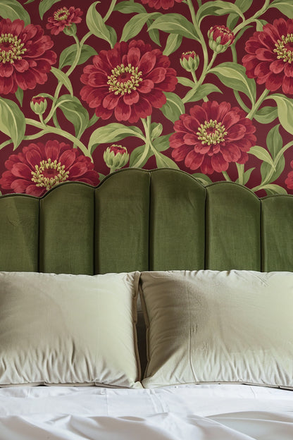 Detailed view of red zinnia petals and green stem ribbons on wallpaper