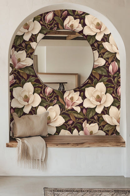 Detailed view of plum background wallpaper with large cream magnolia flowers and green leaves