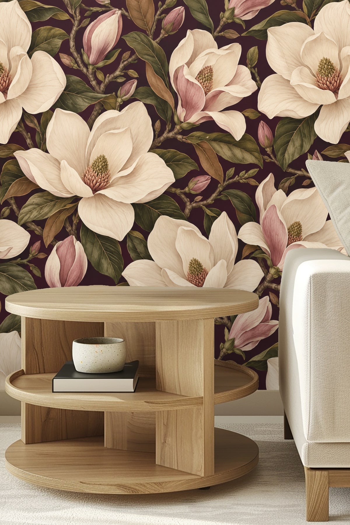 Close-up showing soft cream petals and pink-tinged magnolia buds against deep plum