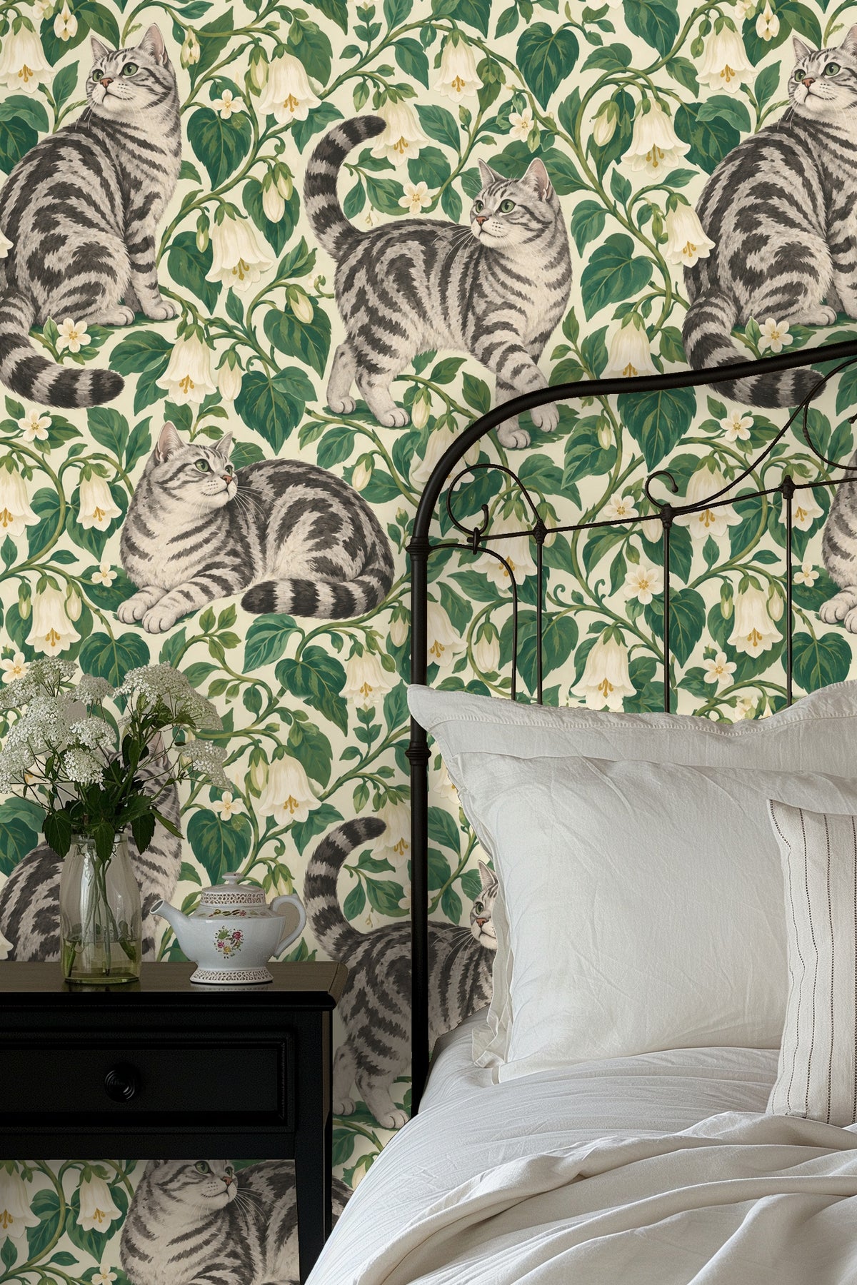 Side view of a tabby cat figure integrated into botanical wallpaper.
