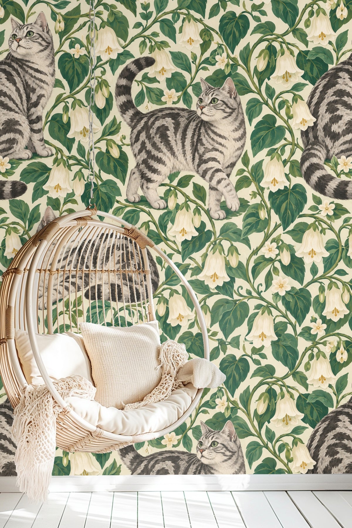 Bedroom wall decorated with Bellvine Cat Tangle wallpaper, featuring tabby cats and floral pattern behind green bedding.