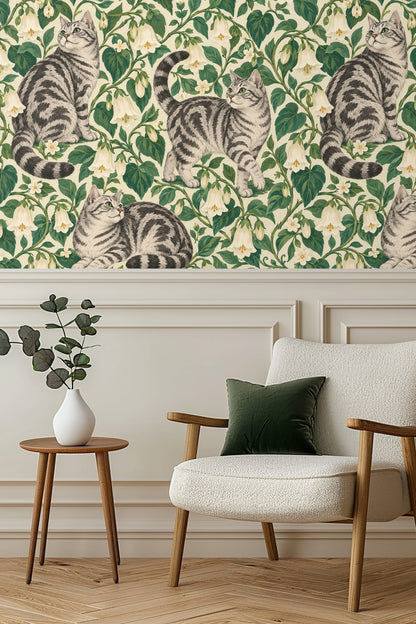 Close-up of tabby cat figures and bellvine flowers in wallpaper pattern.