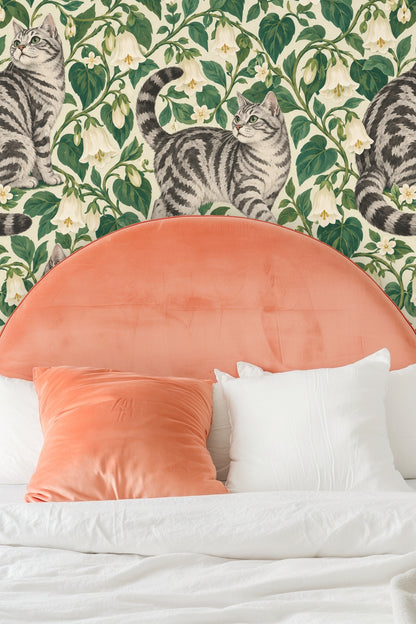 Wallpaper detail illustrating curled and sitting tabby cats in floral foliage.