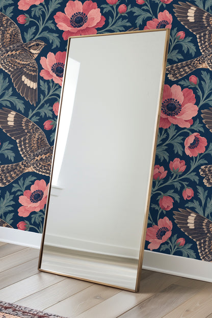 Clusters of coral-pink anemones and green leaves on deep navy wallpaper