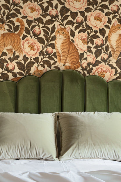 Cats positioned among unfolding and closed peony flower buds on wallpaper