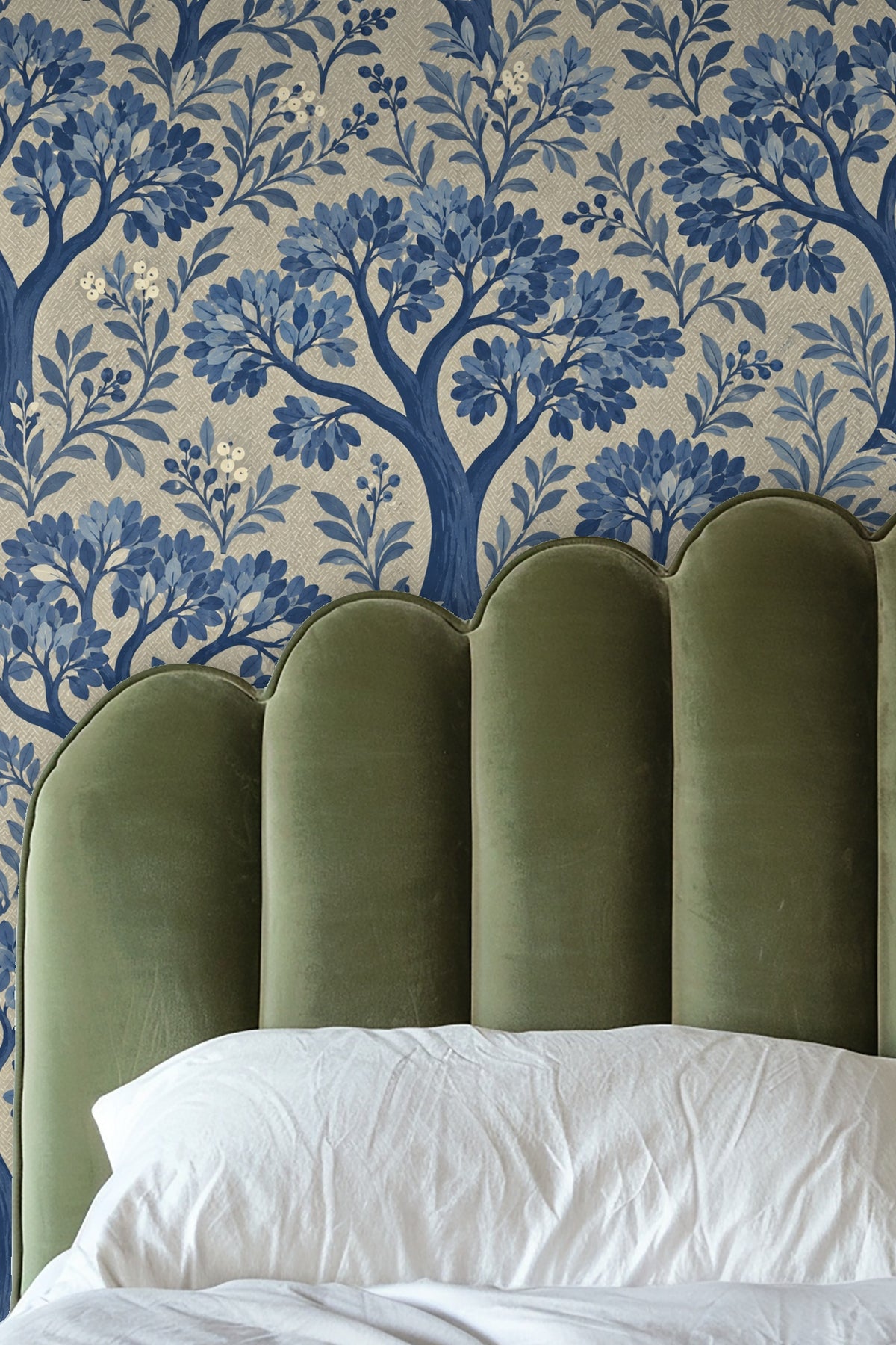 Artistic painted brushstroke detail of leaves in different shades of blue on wallpaper