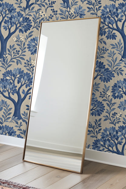 Pattern repeat showing multiple stylized trees with clustered blue leaves on beige background