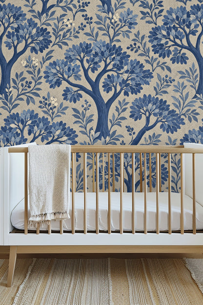 Close-up of blue painted tree branches with leaves and berries on textured beige background