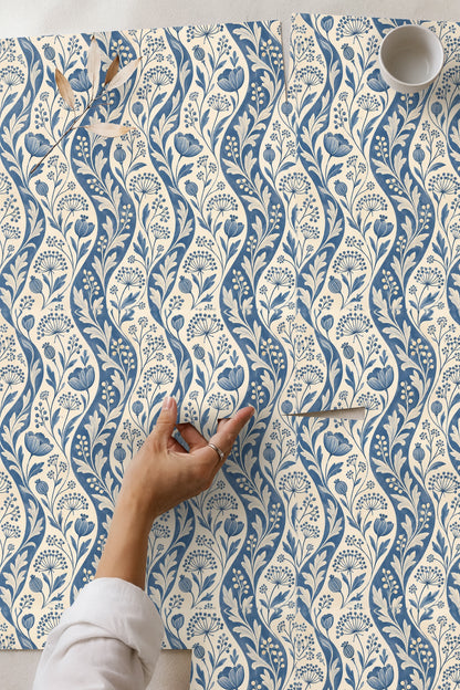 Close-up of blue and white floral seed pod detail on Ticking Seedwave wallpaper