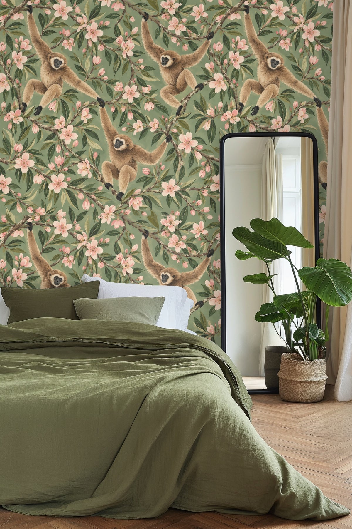 Wallpaper featuring gibbons swinging among almond blossom branches on a muted green background