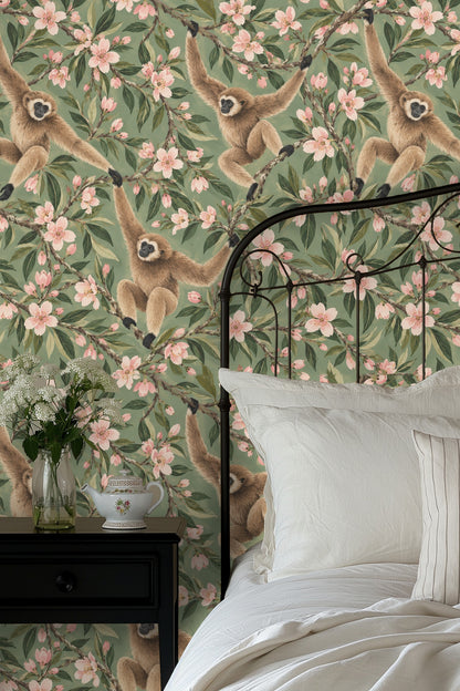 Branch filled with pink almond blossoms and green leaves from the mantelpiece perspective