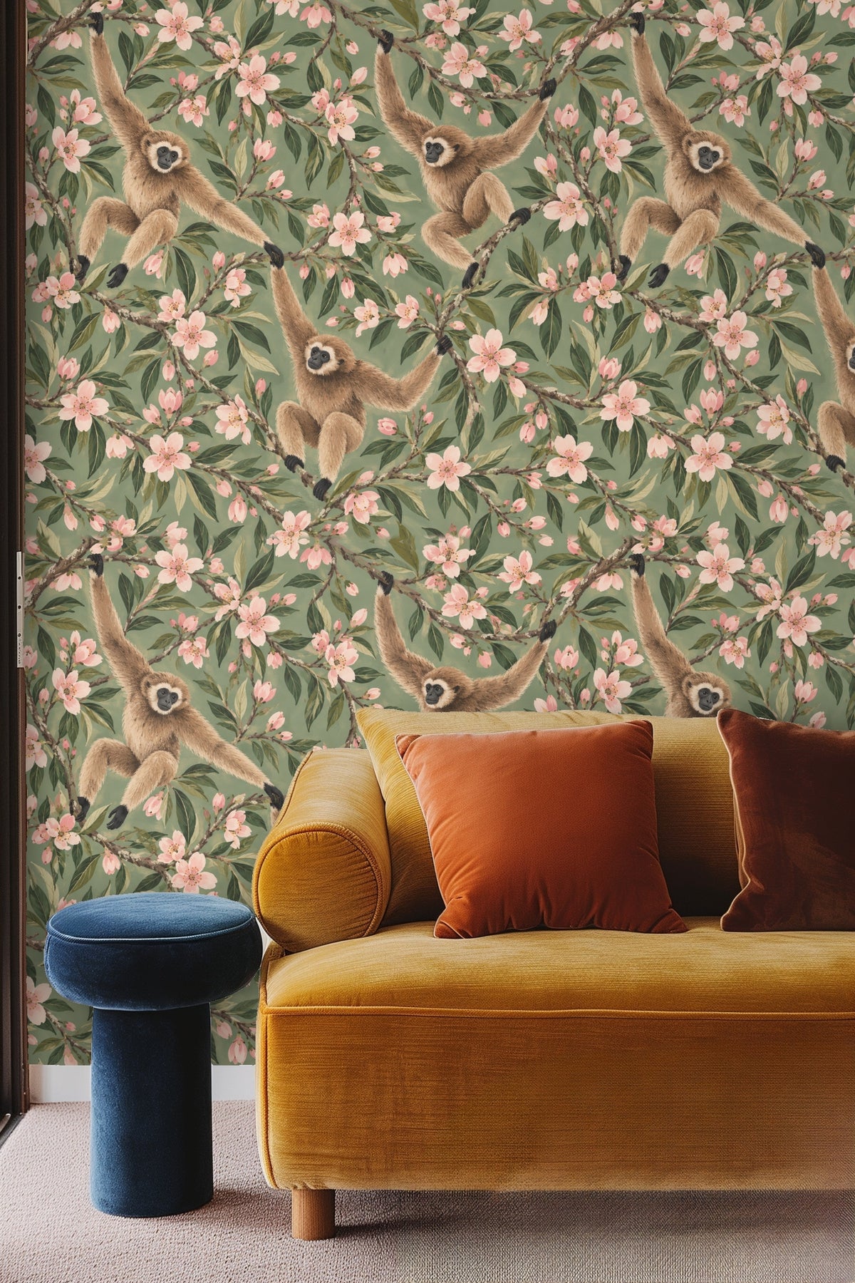 Pattern showing repeated motifs of three gibbons sitting and climbing almond blossom branches