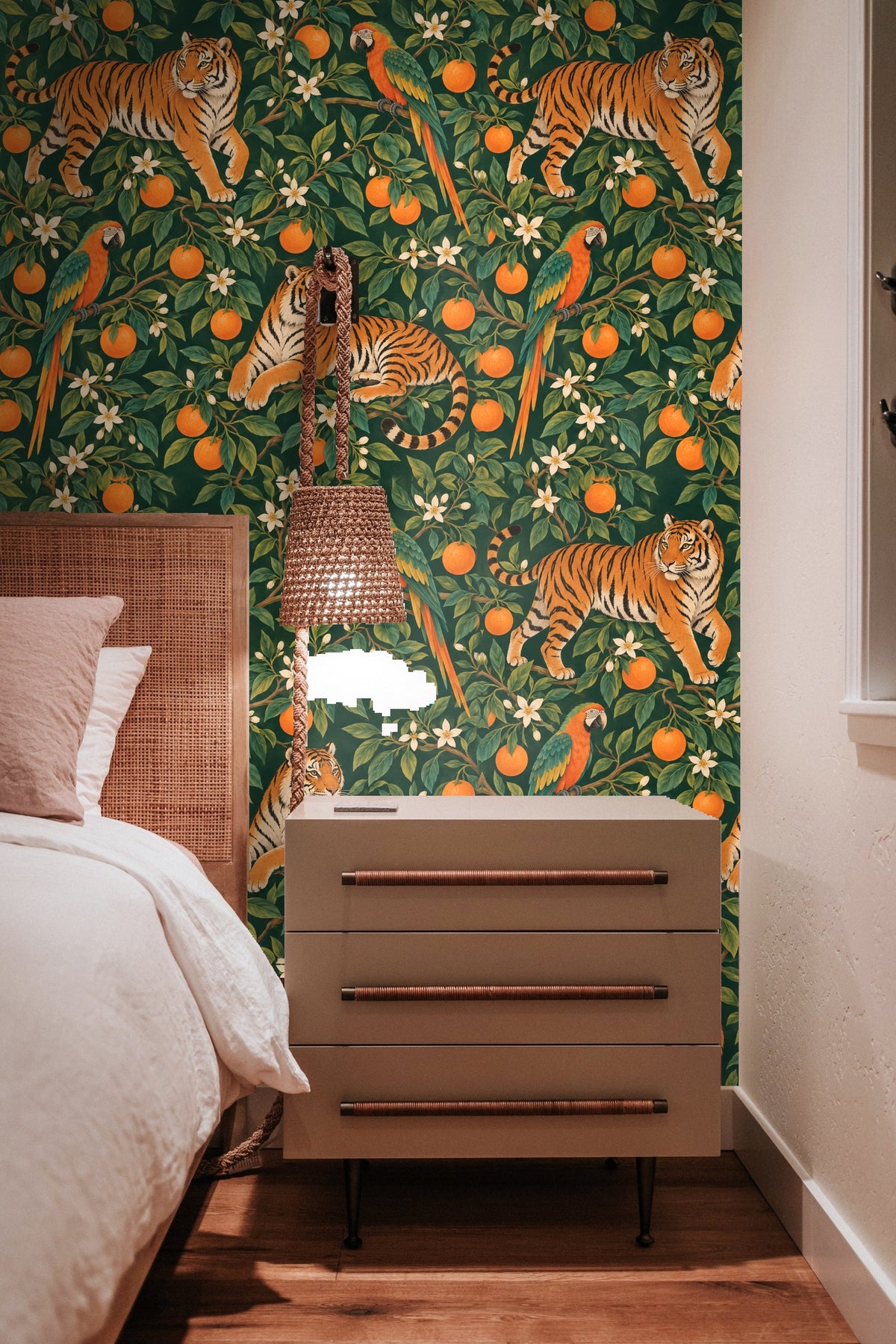Detail of tiger resting amid green leaves and orange fruits in the wallpaper