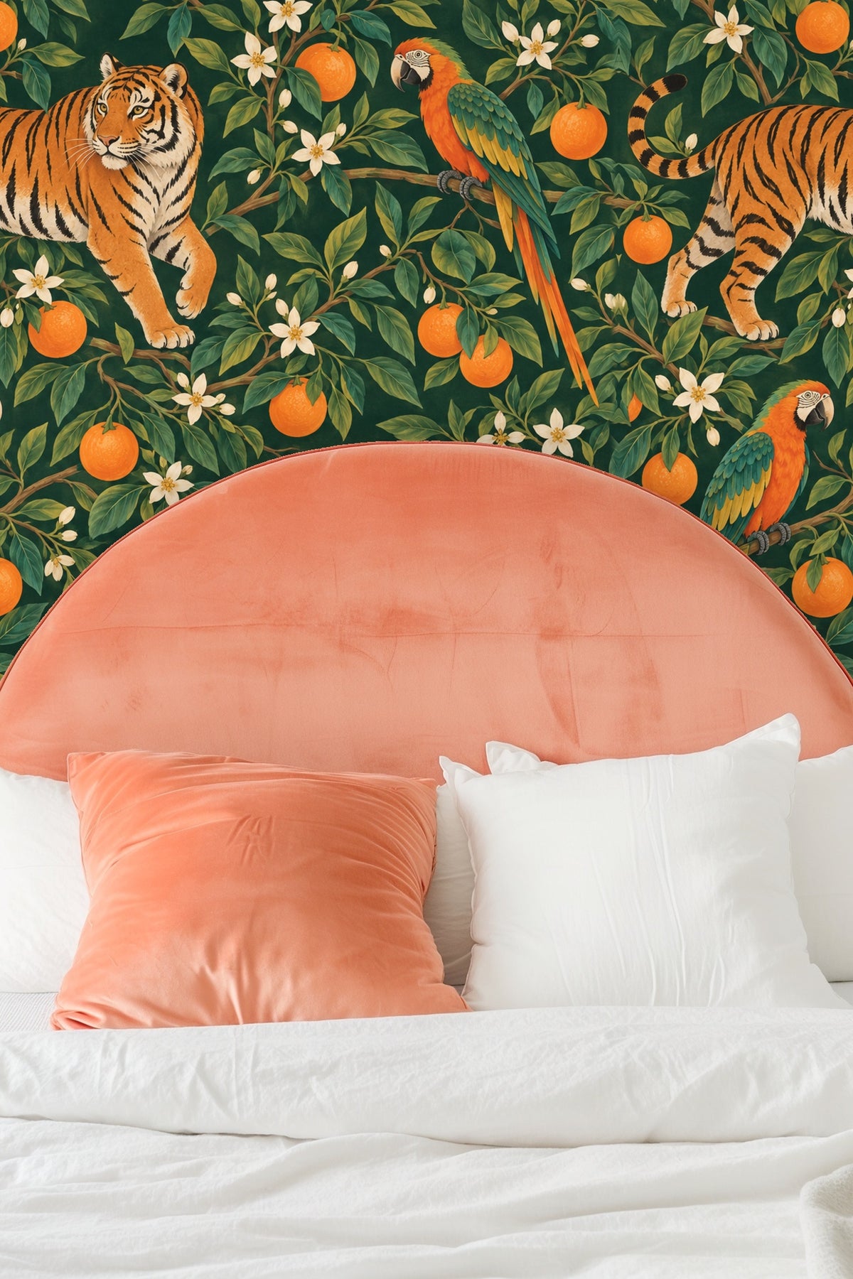 Living room with Tiger Grove wallpaper behind an orange velvet sofa and white coffee table