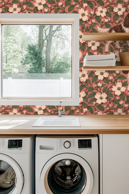 Close-up of wallpaper in a room with a lit candle and flowers on a wooden table