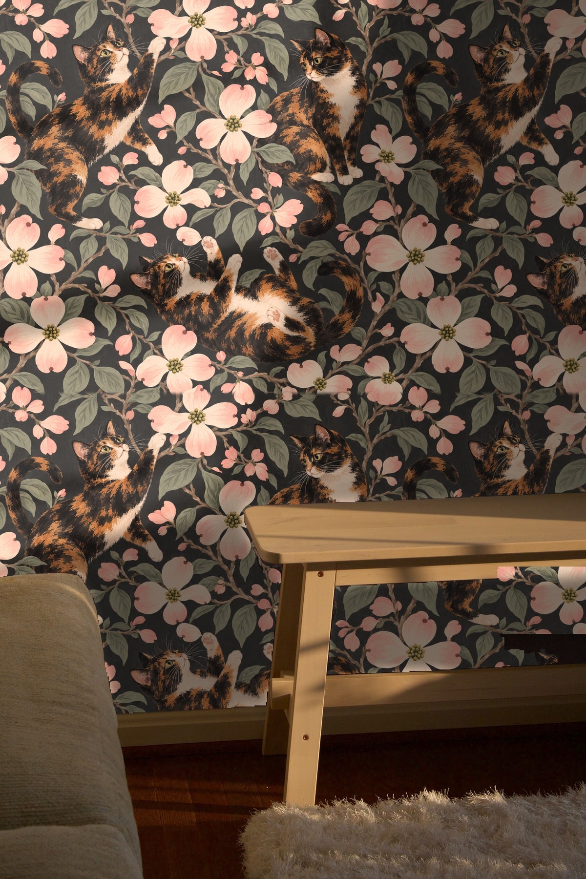 Wallpaper corner view showing repeated pattern of dogswood blossoms and calico cats.