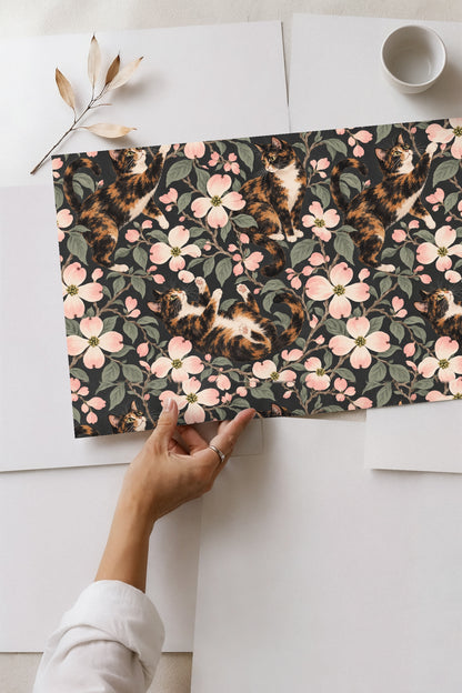 Artwork showing detailed brush strokes of calico cat fur and dogwood flower petals.
