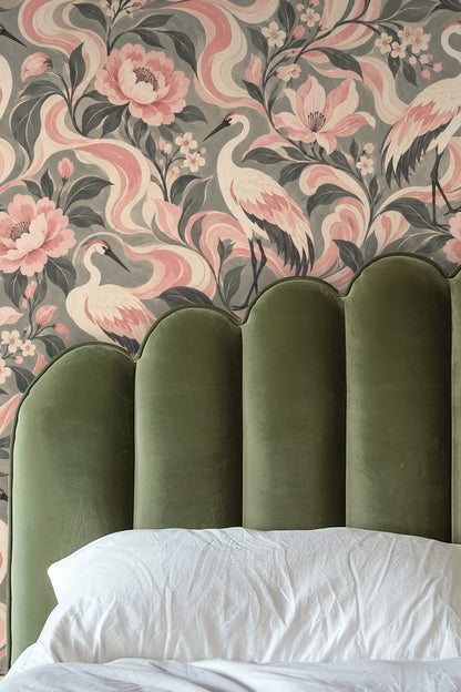 Flowing ribbon-like pink and cream shapes weaving through floral and crane imagery on wallpaper background