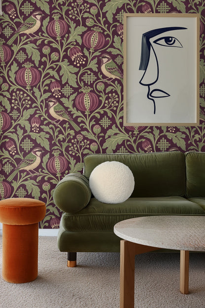 Damson Seed Weave original wallpaper artwork showing pomegranate pods, green leaves, and small birds on purple background