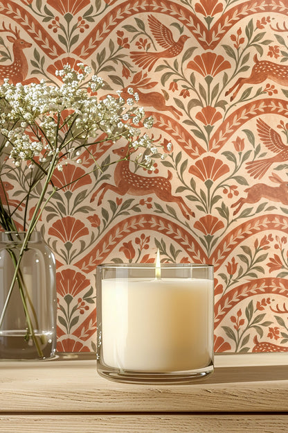 Terracotta wallpaper repeating pattern with leaping deer, birds, and hares framed by curved botanical arches