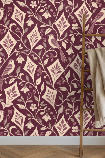 Close-up of wallpaper showing birds perched on intertwined vines and diamond-shaped botanical motifs in plum and cream colors.