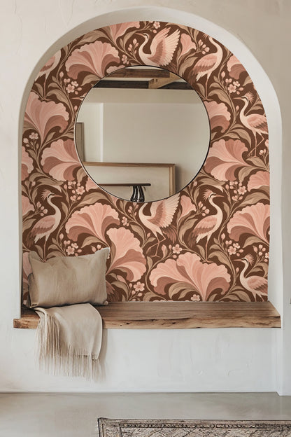 Wallpaper pattern showing stylized cranes and large gingko leaves in blush and brown tones.