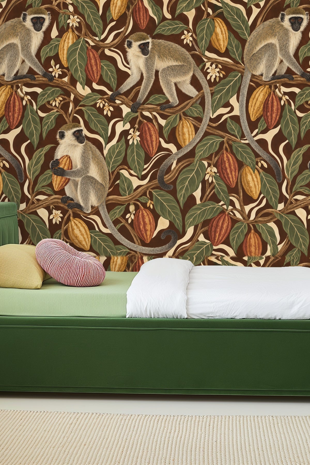 Living room with orange sofa and cacao vervet tangle wallpaper on the wall