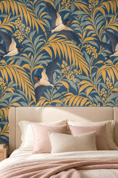 Close-up view of Palm Arcade Swallows wallpaper behind a leather armchair and marble side table