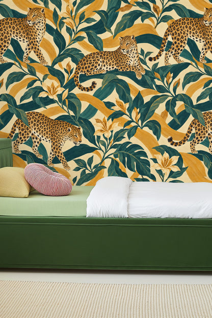 Living room wall with Amber Panther Stripe wallpaper behind a round wooden side table and sofa