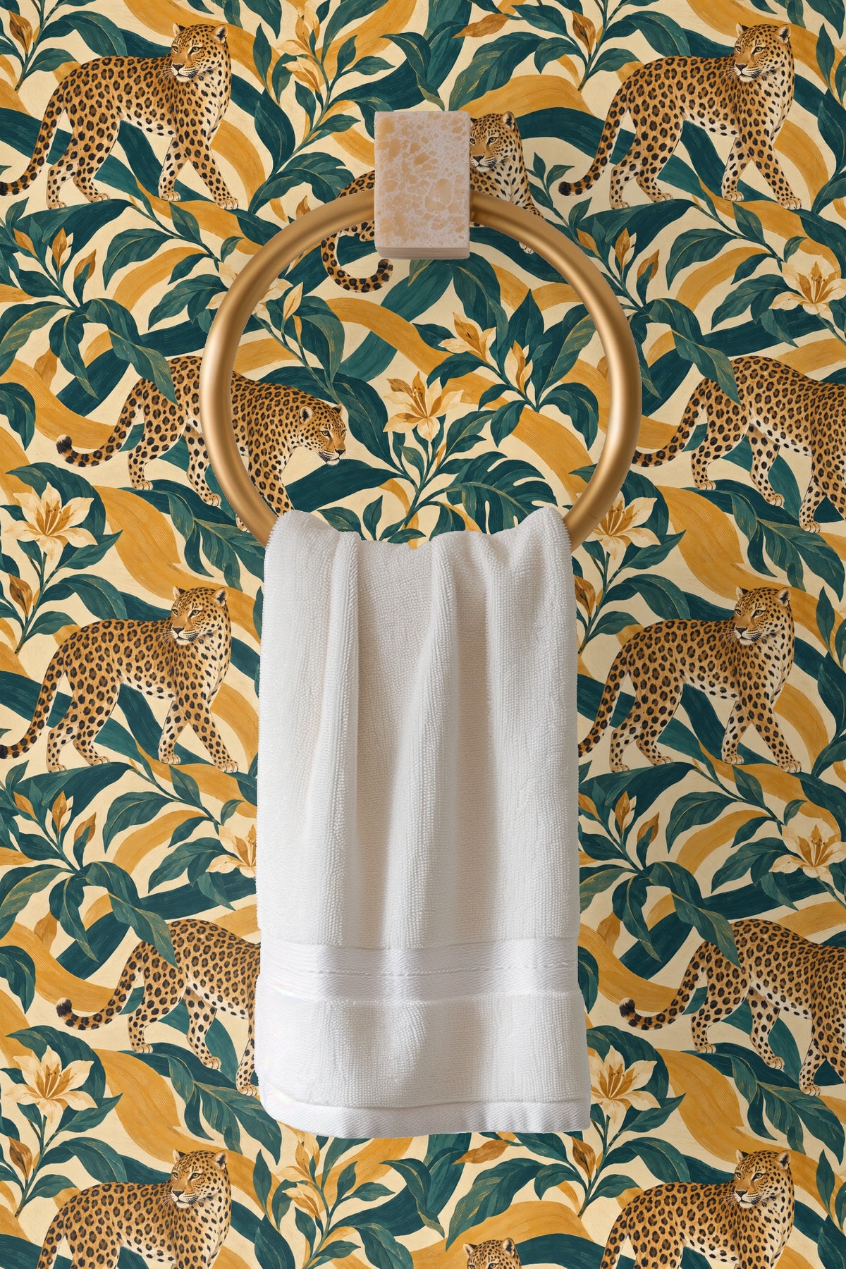 Close-up detail of amber leopard fur and teal leaves in wallpaper