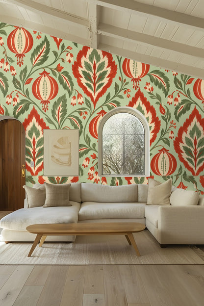Bedroom headboard wall decorated with Ikat Lantern Leaf wallpaper featuring large-scale botanical ikat pattern in warm tones.