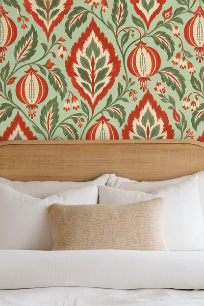 Close-up of Ikat Lantern Leaf wallpaper showing bold lantern motifs and leafy patterns in orange, green, cream, and mint.