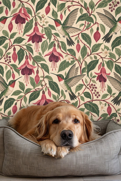 Living room corner featuring Nectarwing Fuchsia wallpaper behind a light wood coffee table and white sofa.