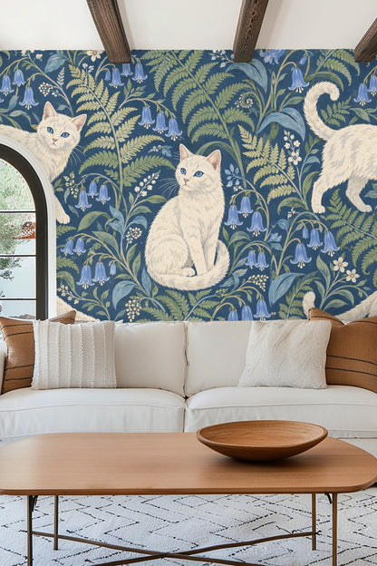 Living room with a white sofa, red chair, and Blue Fern Catwalk wallpaper wall