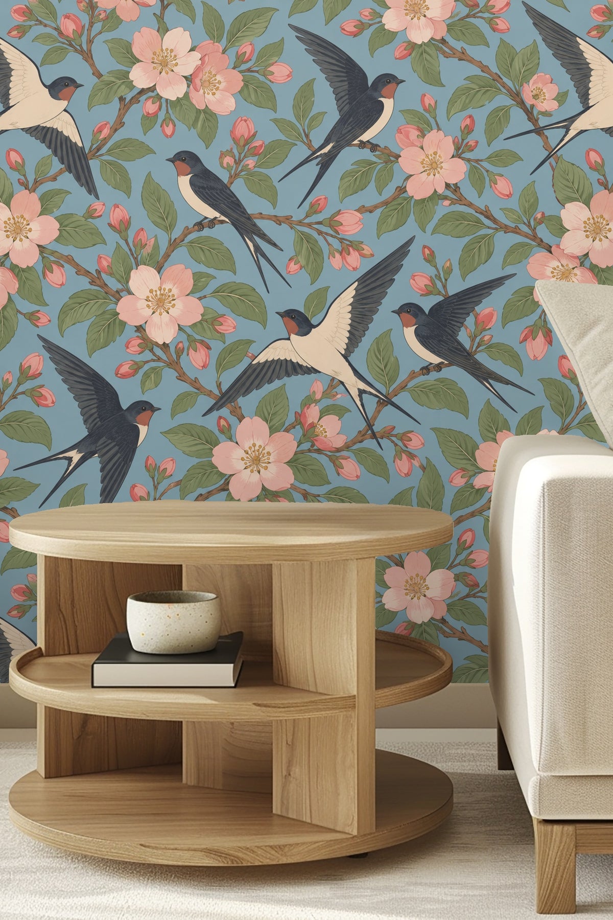 Living room with Swallow Orchard wallpaper, white curved couch, and mid-century modern orange chair