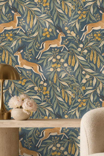 Wallpaper corner showing repeating pattern of leaves and antelopes in mid-leap
