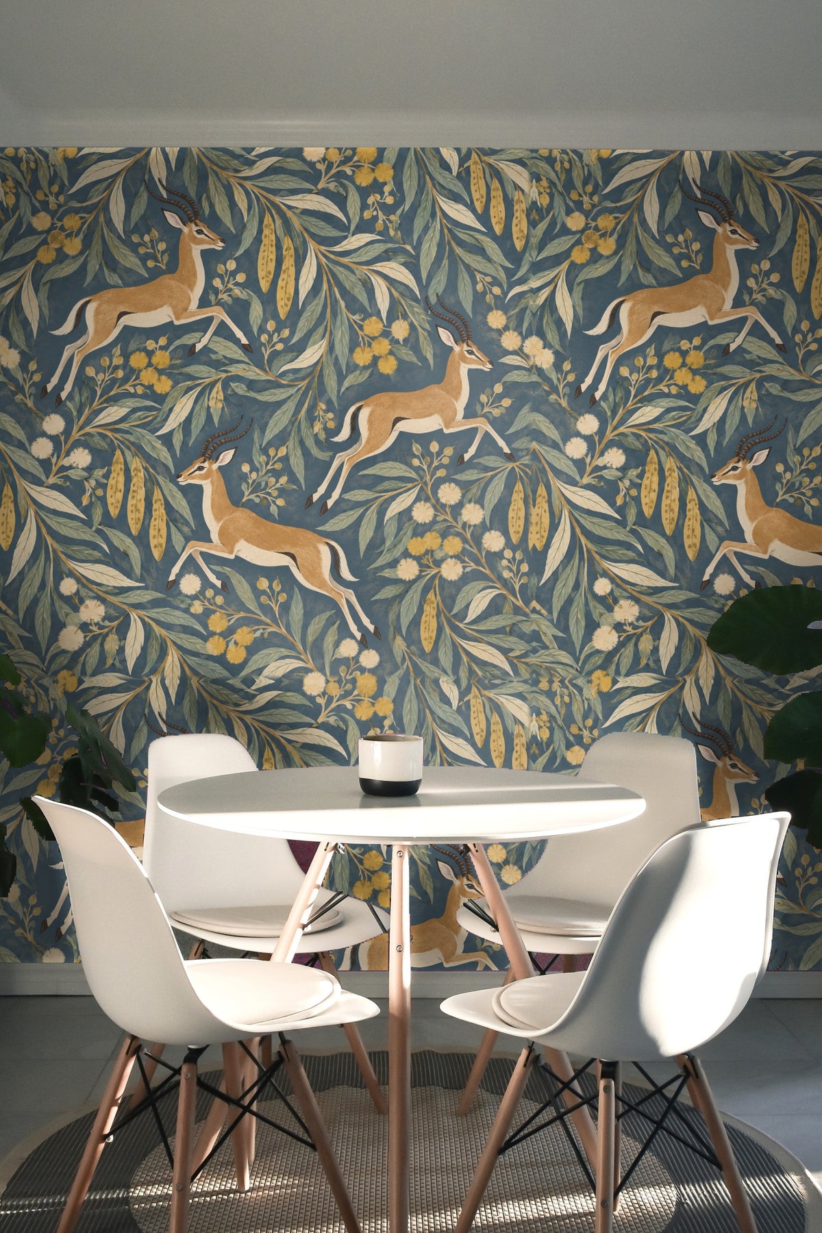 Wide wallpaper view displaying balanced composition of leaves, flowers, and antelopes