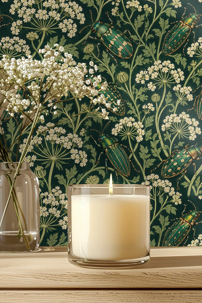 Bathroom vanity area showing parsley beetles wallpaper under a brass lit mirror