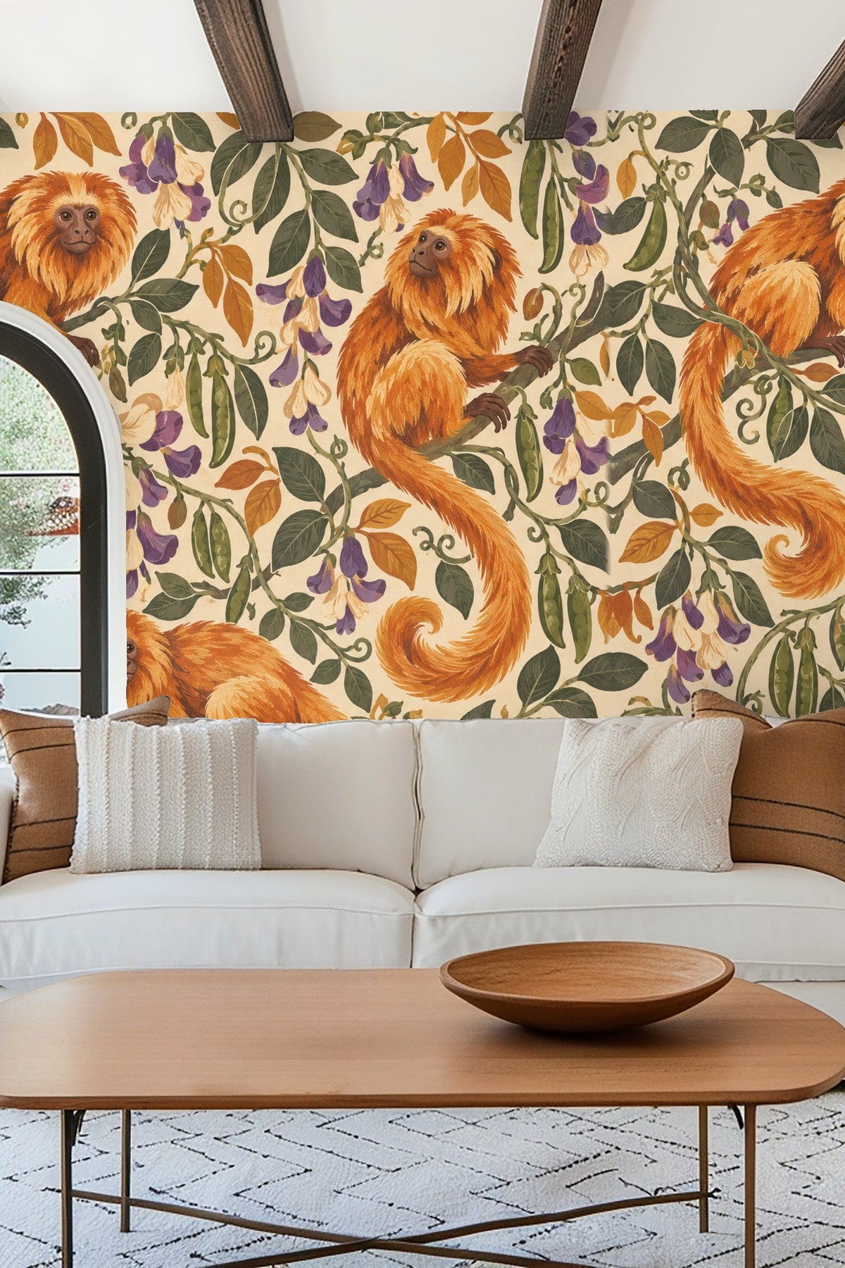 Yellow mustard velvet headboard in front of wallpaper with tamarin monkey pattern